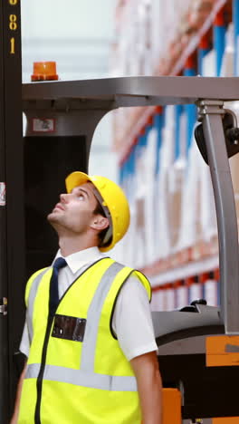 Male-warehouse-worker-checking-stock-for-shipping