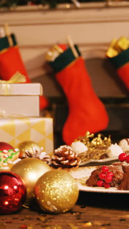 Close-up-of-various-christmas-desserts-and-gifts