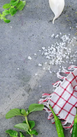 Various-spices-and-ingredients-on-concrete-background