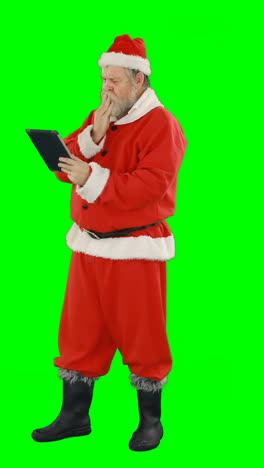 Santa-claus-using-digital-tablet