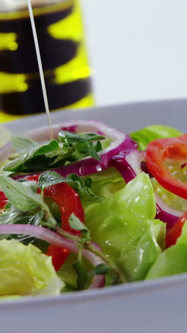 Oil-being-poured-in-salad