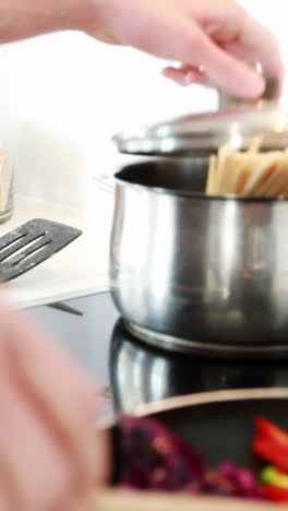 Man-preparing-a-food-in-kitchen