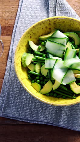 Salad-with-red-wine-on-wooden-table