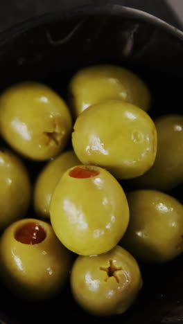 Crispy-biscuits,-cheese-and-bowl-of-green-olives