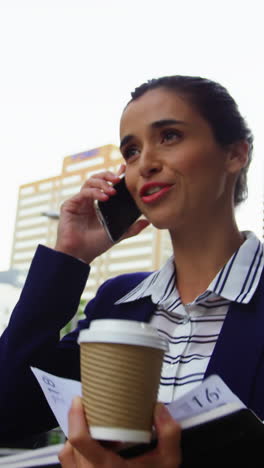 Businesswoman-talking-on-mobile-phone