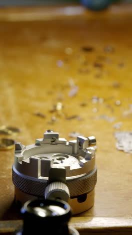 Close-up-of-clock-repairing-tool-and-screws