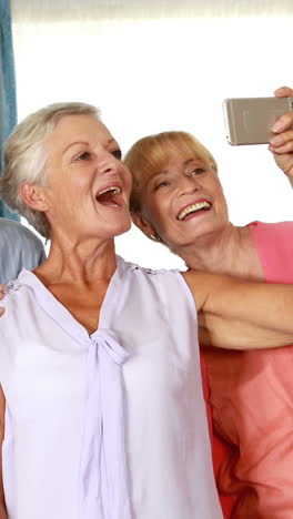 Senior-citizen-taking-selfie-on-mobile-phone