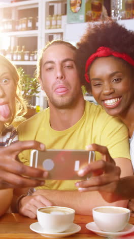 Friends-making-funny-faces-while-taking-a-selfie