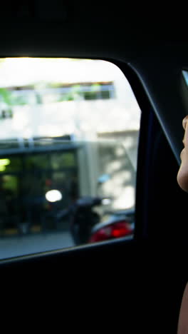 Businesswoman-travelling-in-car