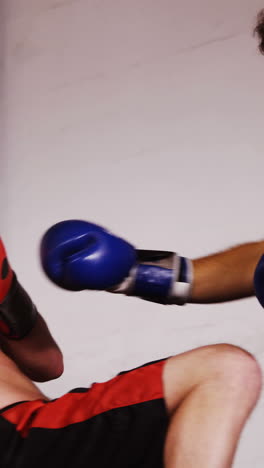 Two-boxers-practicing-in-boxing-ring