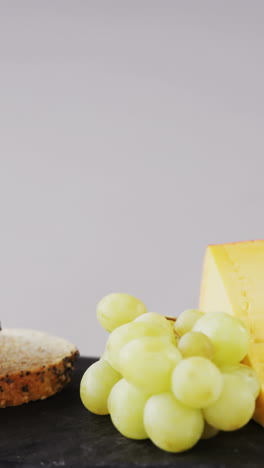 Cheese,-grapes-and-bread-on-tray