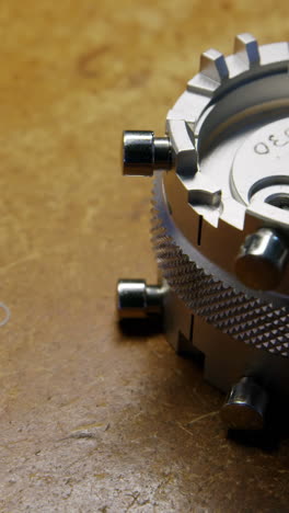 Close-up-of-clock-repairing-tool-and-screws