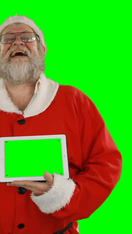 Weihnachtsmann-Hält-Digitales-Tablet