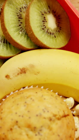 Close-up-of-dried-fruits-with-banana,-kiwifruit-and-muffin