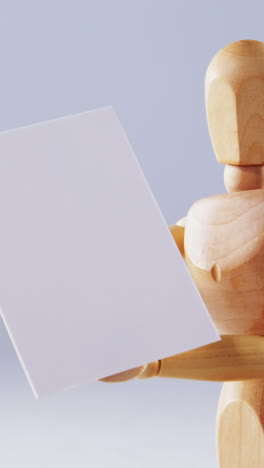 Figurine-holding-blank-placard