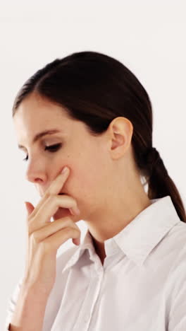 Businesswoman-standing-against-white-background