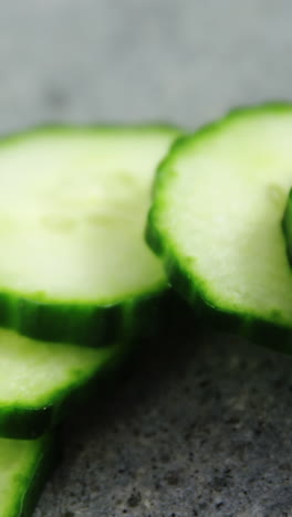 Sliced-cucumber-on-concrete