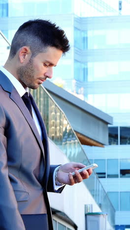 Businessman-using-mobile-phone