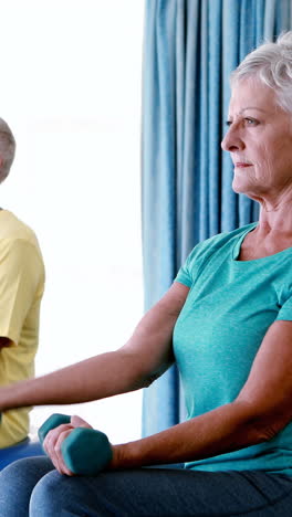 Senior-citizens-exercising-with-dumbbells