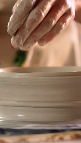 Hands-of-female-potter-making-a-pot