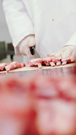 Butcher-cutting-raw-meat