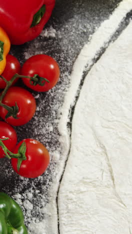 Pizza-flour-with-vegetables-on-table