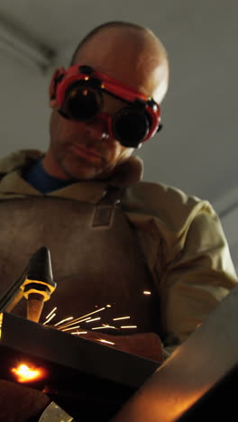 Welder-welding-a-metal