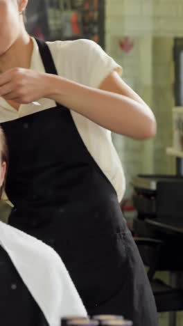 Hairdressers-trimming-their-client-hair