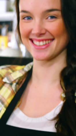 Portrait-of-waitress-making-cup-of-coffee-at-counter