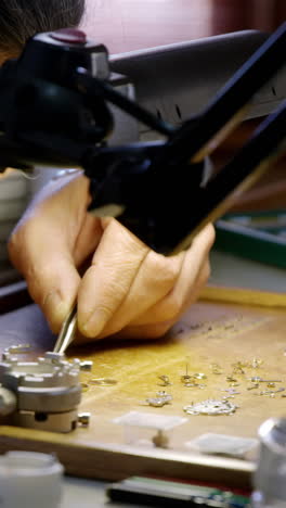 Close-up-of-horologist-repairing-a-watch