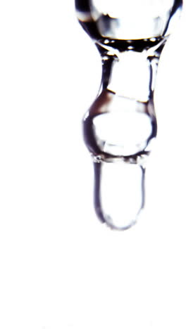 Close-up-of-dropper-with-liquid