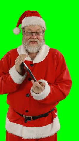 Santa-claus-using-digital-tablet