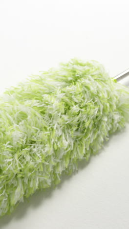 Close-up-of-green-cleaning-duster