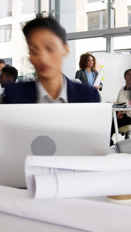 Time-lapse-of-businesswoman-having-coffee-while-working-at-desk