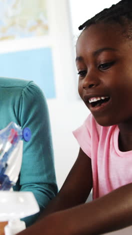 school-kids-preparing-paper-craft-in-classroom