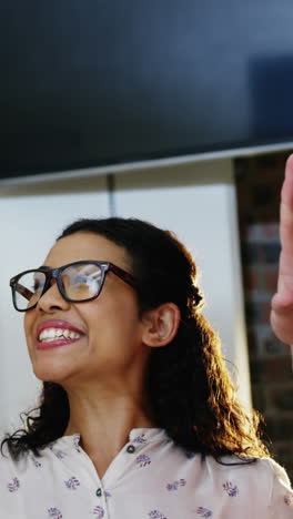 Business-executives-giving-high-five-to-each-other