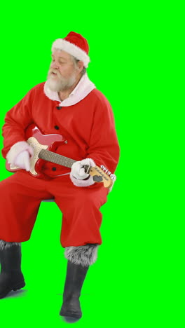 Santa-claus-singing-a-song-and-playing-guitar