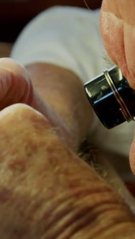 Close-up-of-horologist-repairing-a-watch