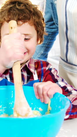 Father-and-son-preparing-cupcake