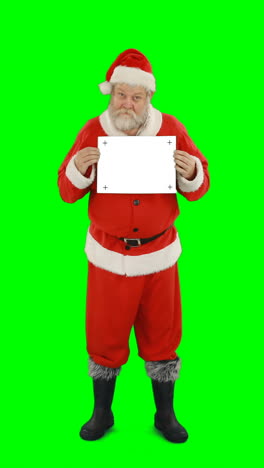 Santa-claus-holding-blank-board