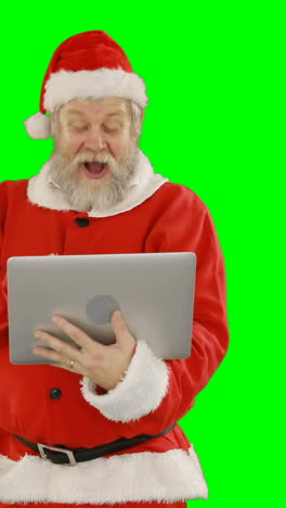 Papá-Noel-Usando-La-Computadora-Portátil