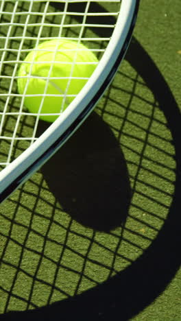 Close-up-of-tennis-racket-and-ball