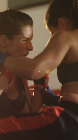 Two-female-boxers-practicing-in-boxing-ring