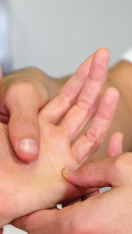 Physiotherapist-giving-hand-massage-to-a-woman