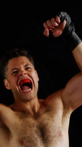 Excited-male-boxer-posing-after-victory