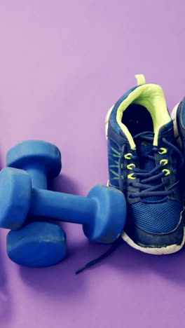 Shoes,-dumbbells,-water-bottle,-apple-and-napkin