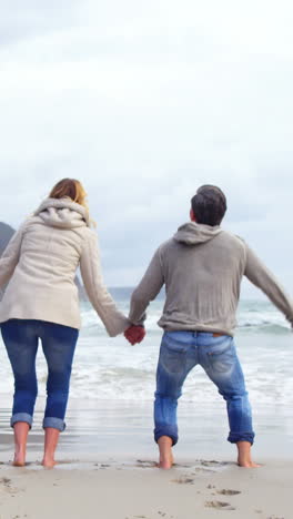 Mature-couple-enjoying-on-beach