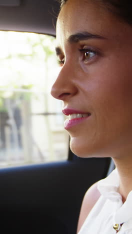 Businesswoman-travelling-in-car