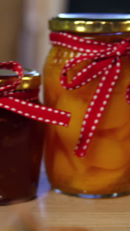 Jars-of-pestos,-jam-and-preserves-on-display-counter