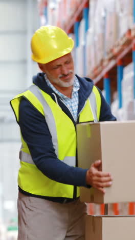 Warehouse-worker-suffering-from-back-pain-while-working